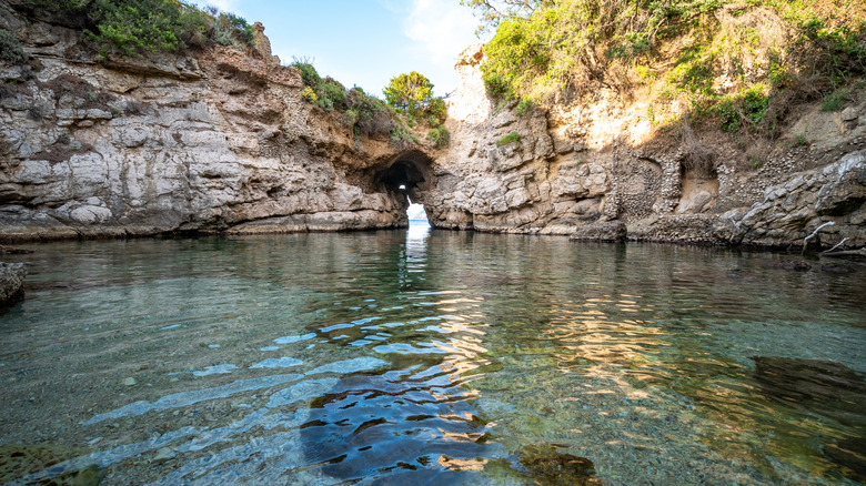 Rock arch ends Bagni Regina Giovanna on Capo di Sorrento in Sorrento, Italy
