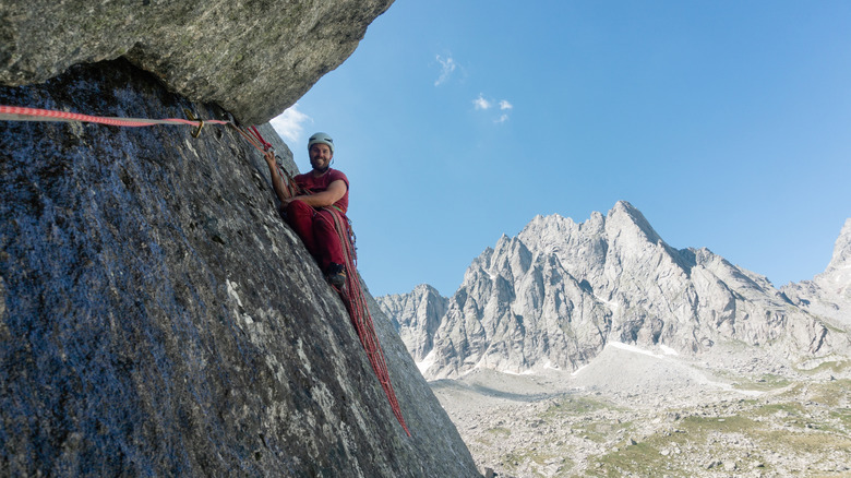 Climber on a big wall near Val di Mello