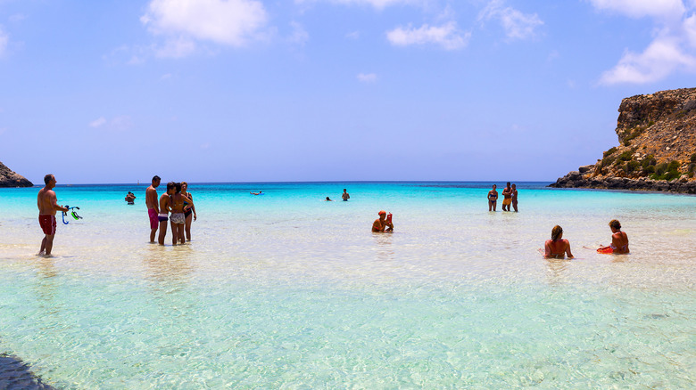 people swimming at Rabbit Beach, Lampedusa