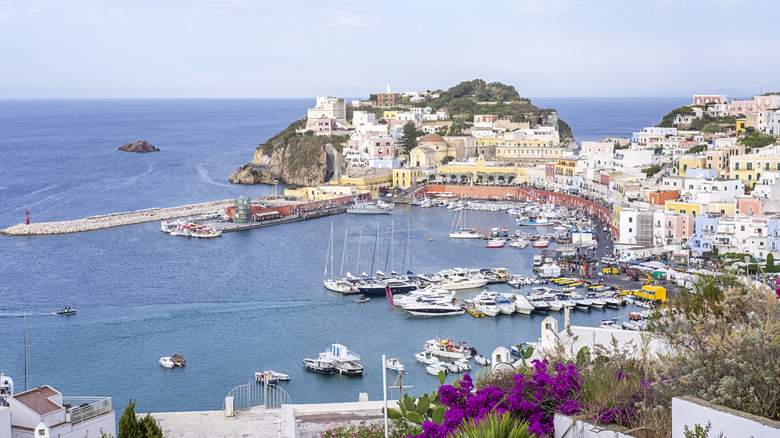 Landscape view of sea, ships, and buildings at Ponza's port, Italy