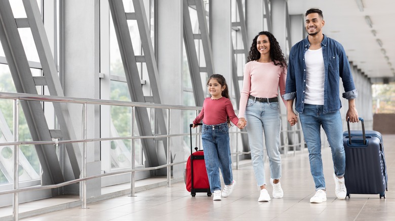 Family walking in airport