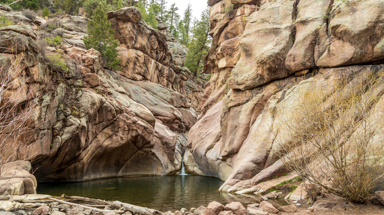 Paradise Cove swimming hole with surrounding rock cliffs in Colorado