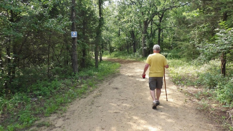 A man walking along one of the Lehigh Portland Trails in Kansas.