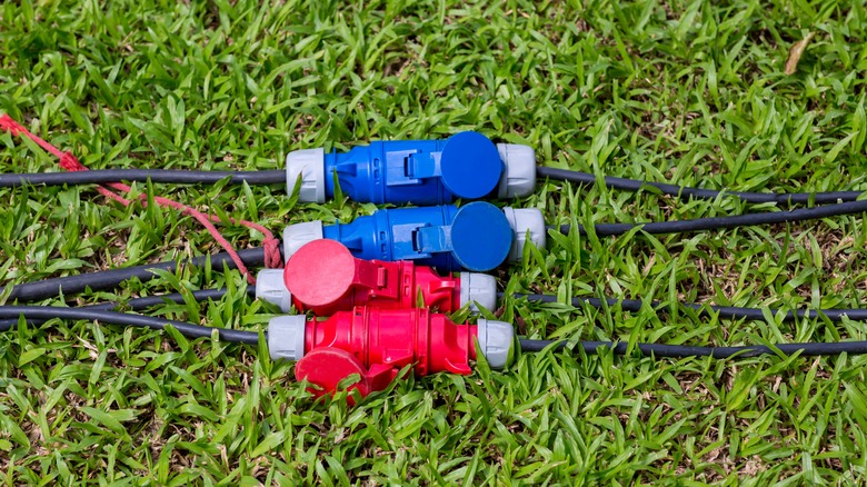 Extension cords and connectors on the grass