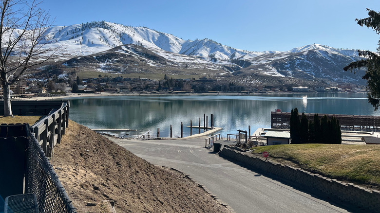 A dock on Lake Chelan surrounded by snowcapped peaks