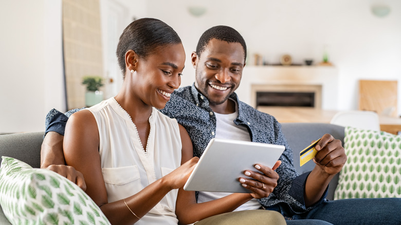 Couple making online purchase