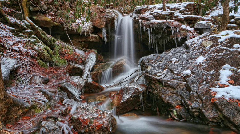 A frozen waterfall surrounded by ice and snow in Lehigh Gorge State Park in Pennsylvania