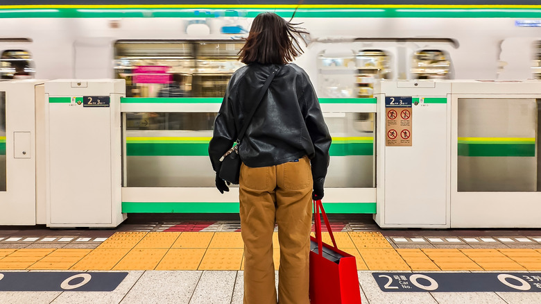 Young traveler waiting for a train