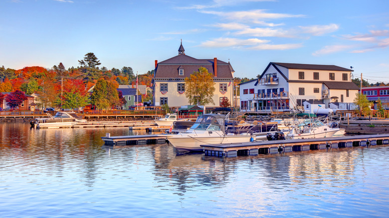 boats lining the docks along the waterfront in Greenville, a town on the southern tip of Moosehead Lake, in Maine