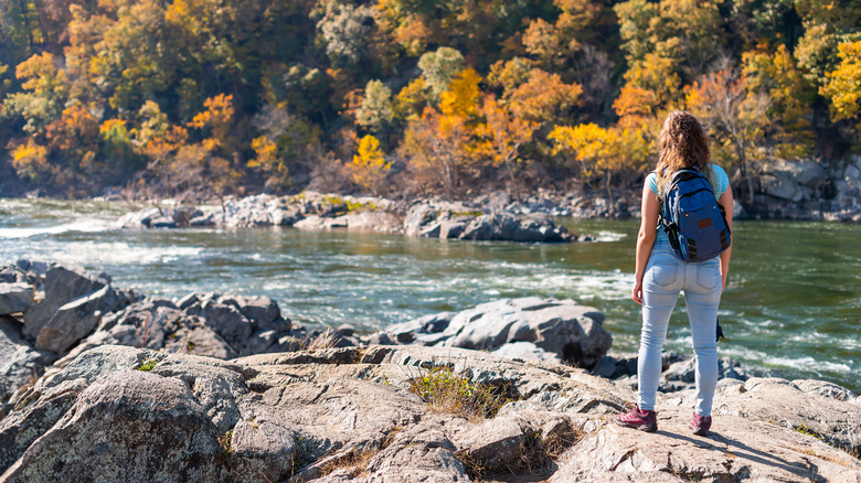 Hiker looking at a river in Maryland