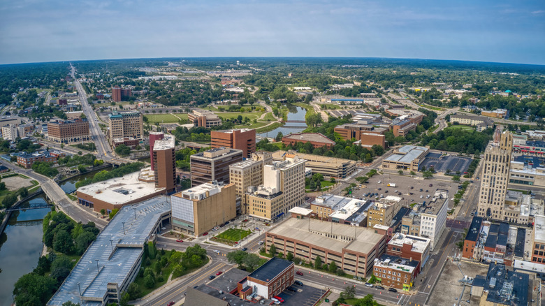 aerial view of Flint, Michigan with buildings, river, and bridges