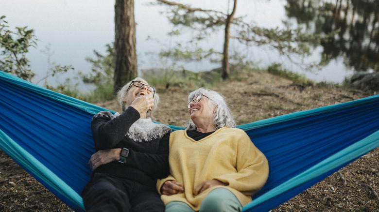 Happy campers relaxing on a hammock