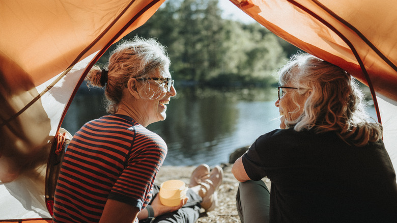 Happy friends at a campsite