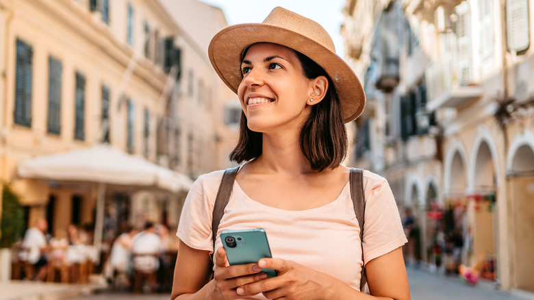 Female traveler with phone