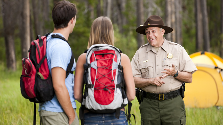 A national park ranger with hikers.