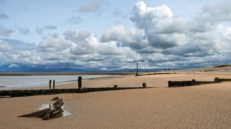 A sandy beach and wooden groins in Lancashire, England.
