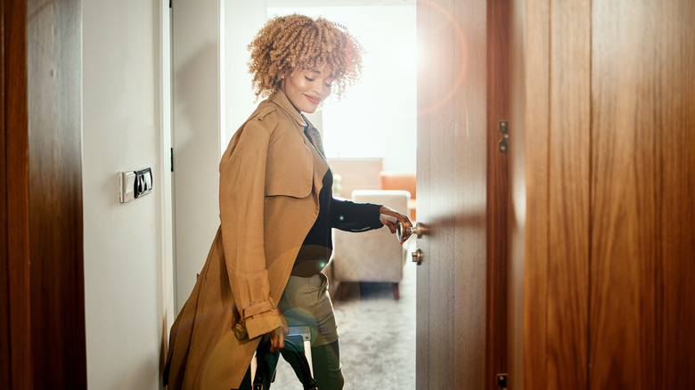 Woman walking into hotel room