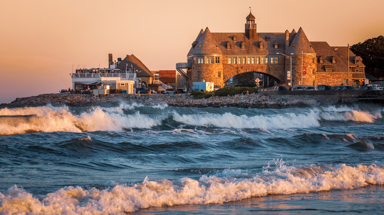 Waves crash onto Narragansett Town Beach at sunset