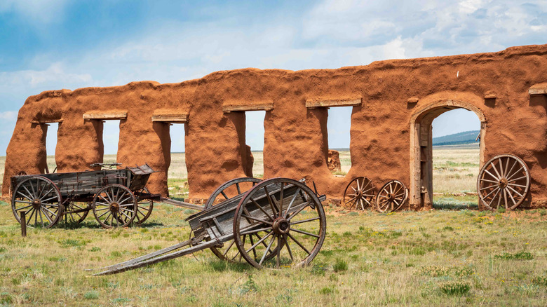 historic wagons in front of ruins at the national monument