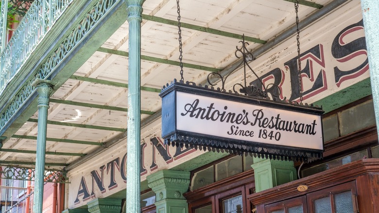 Antoine's Restaurant sign, green iron posts