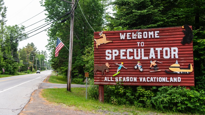 A "Welcome to Speculator" sign on the roadside