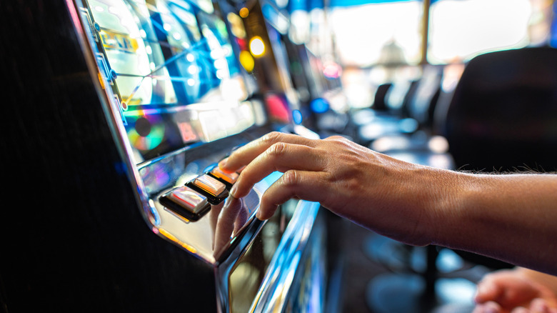 Person playing a slot machine