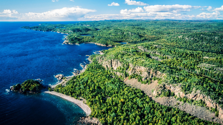 Blue sky and clouds over the dark blue waters of Lake Superior around Pukaskwa National Park in Canada