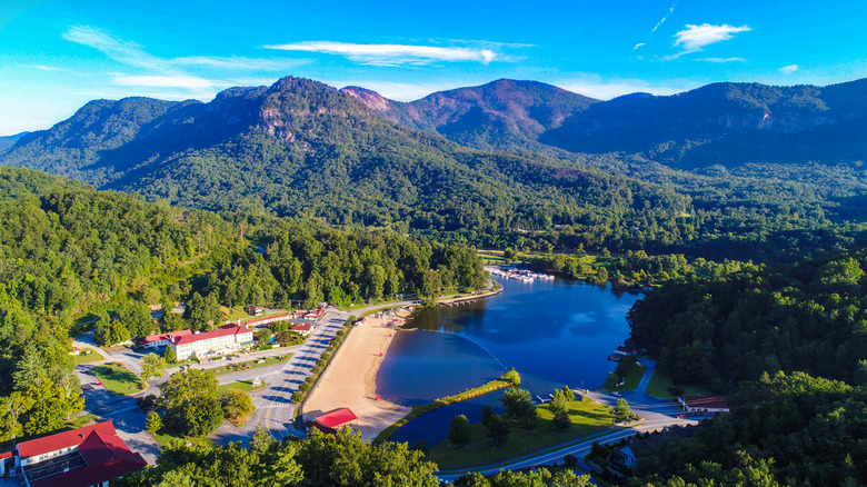 Drone view of North Carolina's Lake Lure with forested mountains in the background