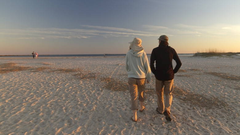 A couple walking on Wrightsville Beach