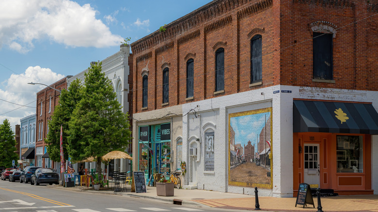 Brick storefronts and a street mural