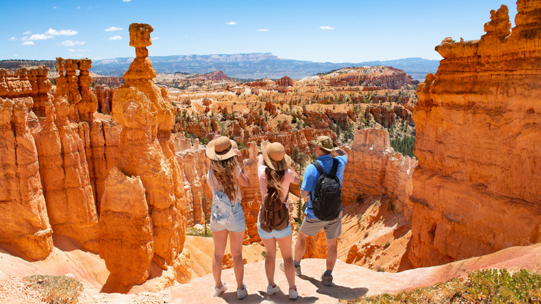 three people looking out at Thor's Hammer in Bryce Canyon National Park