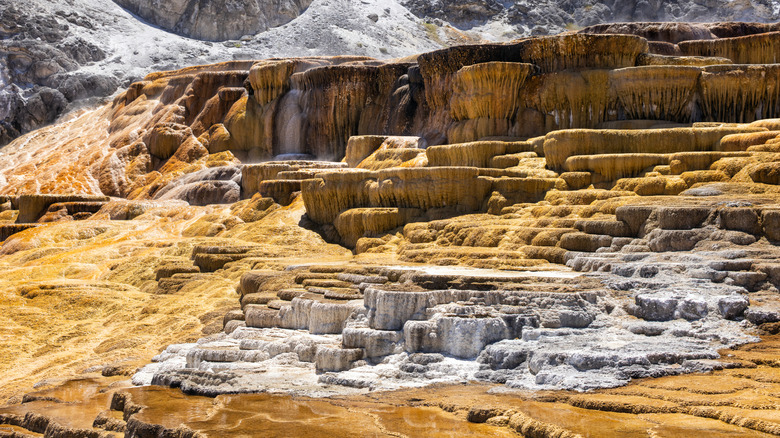 gold, white and brown rock formations from hot springs