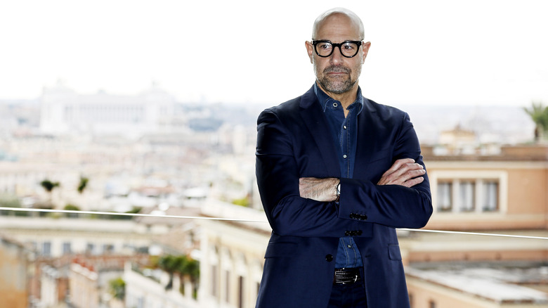 Stanley Tucci on balcony Rome Italy