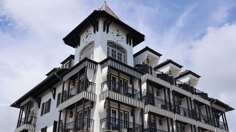 Large black-and-white building with a clock tower