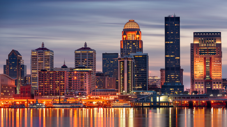 nighttime skyline over a river