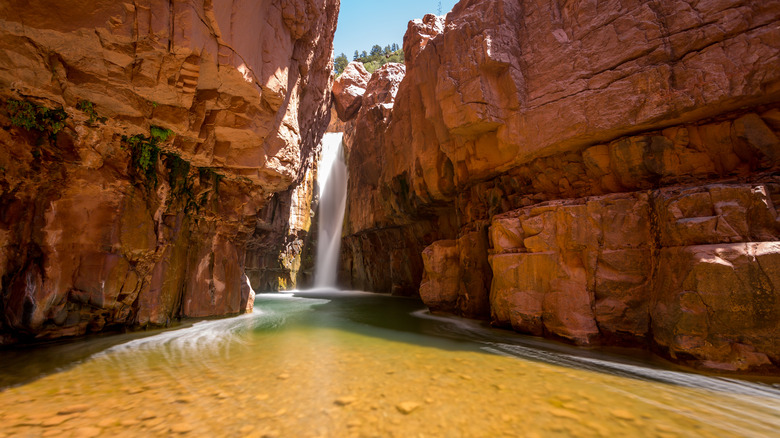 canyon waterfall clear pool