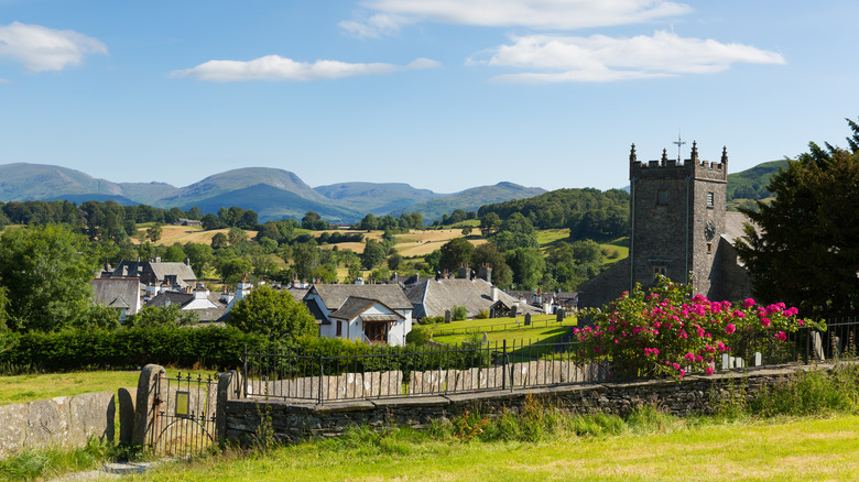village with stone houses and church on sunny day