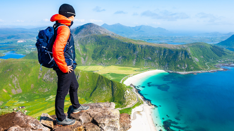 hiker enjoying the nature view of Haukland Beach