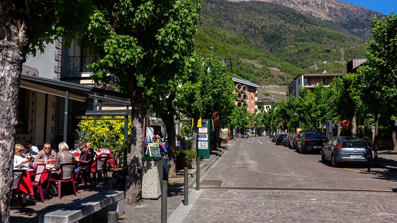 Tourists eating on the street in Tirano