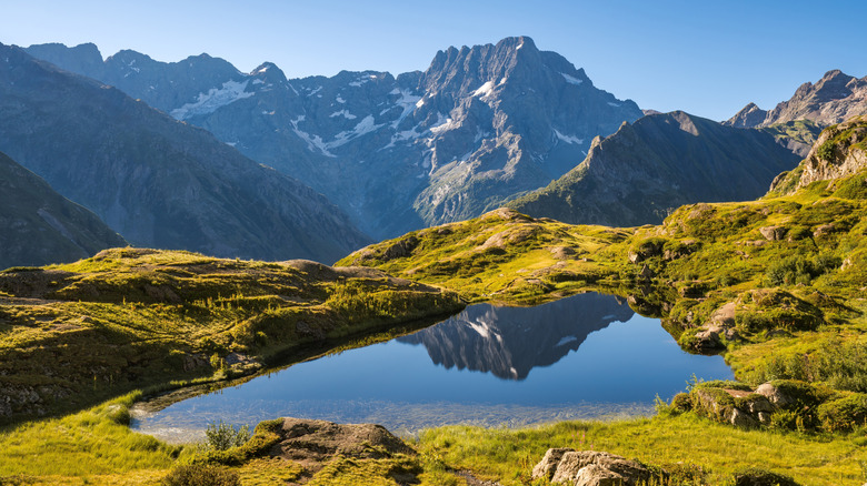 Ecrins National Park and Lauzon Lake in summer with a view of the Sirac mountain peak