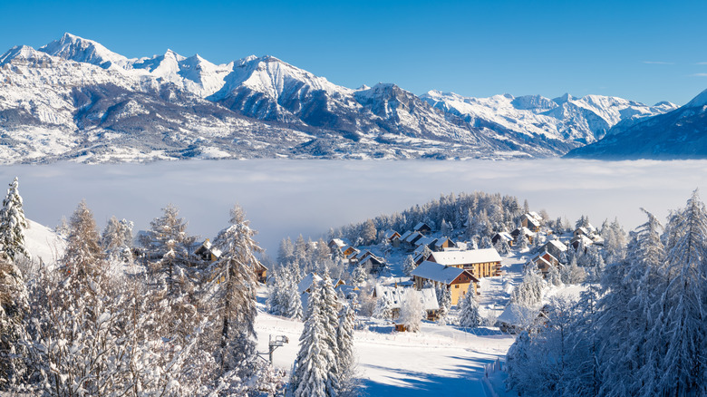 Ski resort in Champsaur Valley covered in snow with view of the mountains in Ecrins National Park