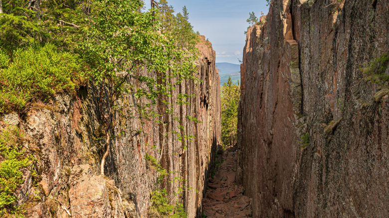 Slåttdalsskrevan, a deep rock crevice in Skuleskogen National Park in Sweden