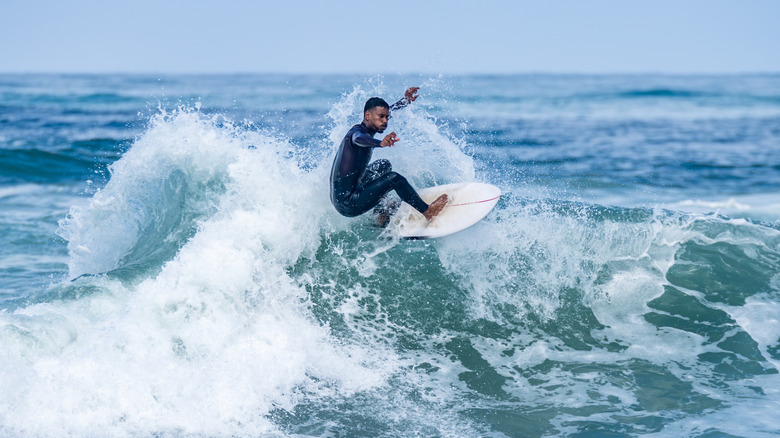 Surfer riding a wave in Portugal