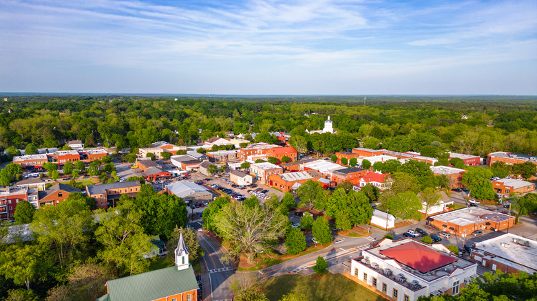 Aerial of Madison, Georgia showing buildings and trees