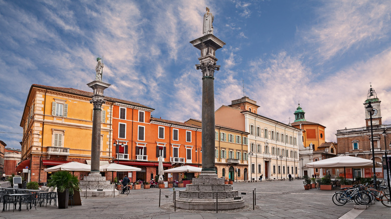 An image of an old town European square with a stone column in the center
