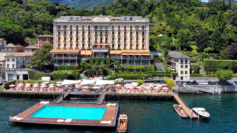 a luxury hotel on the lake with a floating pool