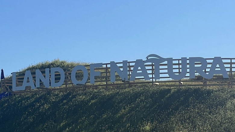 The Land of Natura sign.