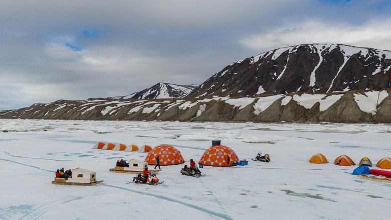 People camping on the ice in Sirmilik National Park in Canada.