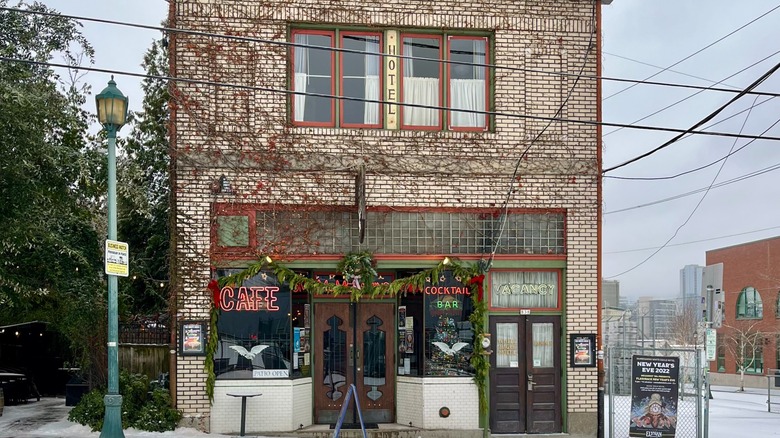 saloon facade at night with neon signs