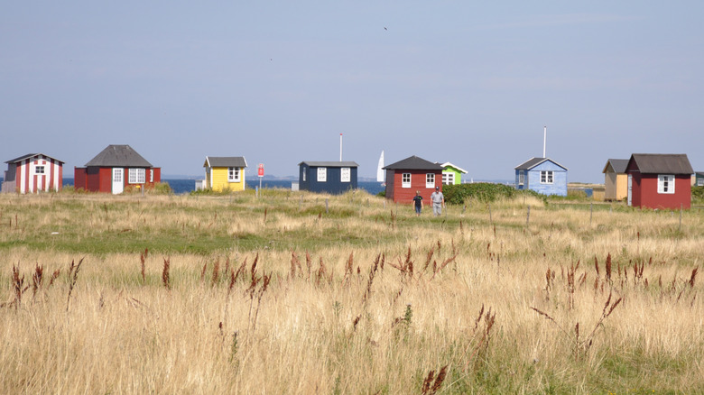 Bright, colorful huts on the beach o the island of Ærø, Denmark